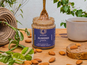 Organic nut butter – bio-activated almond butter on spoon and toast